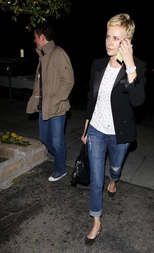 Charlize Theron and Seth MacFarlane walked out of a sushi restaurant together.
Charlize Theron and Seth MacFarlane walked out of a sushi restaurant together.