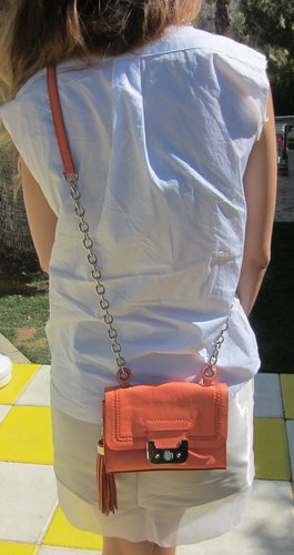 This Diane von Furstenburg coral crossbody bag keeps you hands-free with enough room for phone, camera, and a backup battery — just the essentials.
This Diane von Furstenburg coral crossbody bag keeps you hands-free with enough room for phone, camera, and a backup battery — just the essentials.