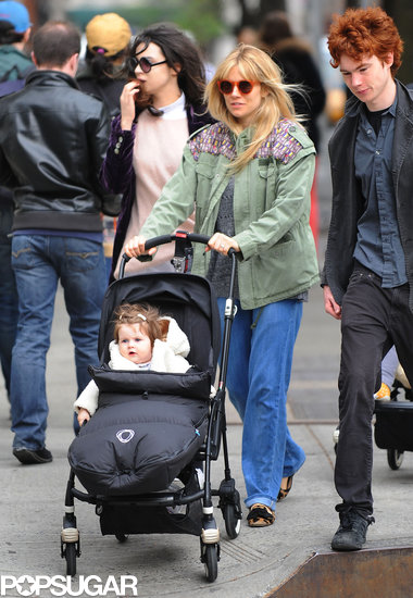 Sienna Miller strolled NYC with her daughter Marlowe wearing an army green jacket with printed shoulder detail, wide-leg jeans, leopard loafers, and round orange sunglasses.
Sienna Miller strolled NYC with her daughter Marlowe wearing an army green jacket with printed shoulder detail, wide-leg jeans, leopard loafers, and round orange sunglasses.