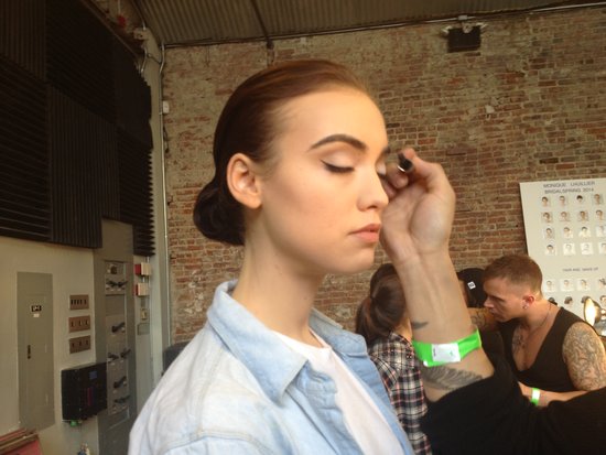 For makeup, MAC lead artist Romero Jennings focused on the eye area. Brushed brows, sleek eyeliner, and a pale white shadow gave the look a slight '60s lilt.
For makeup, MAC lead artist Romero Jennings focused on the eye area. Brushed brows, sleek eyeliner, and a pale white shadow gave the look a slight '60s lilt.