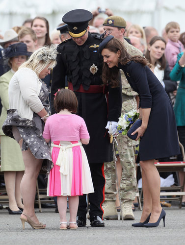 Prince William and Kate Middleton showered a young fan with attention at the Irish Guards Medal Parade in Windsor, England, in June 2011.
Prince William and Kate Middleton showered a young fan with attention at the Irish Guards Medal Parade in Windsor, England, in June 2011.