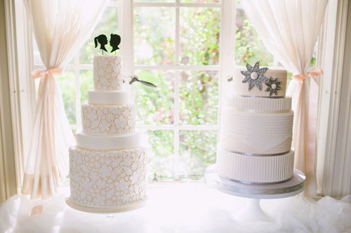 This classic tiered cake on the left looks like it was hand-embroidered with a floral and leaf pattern, and we love that the topper adds a fun, modern touch.
Photo by Jodi Miller Photography via Green Wedding Shoes
This classic tiered cake on the left looks like it was hand-embroidered with a floral and leaf pattern, and we love that the topper adds a fun, modern touch.
Photo by Jodi Miller Photography via Green Wedding Shoes