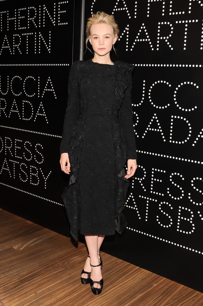 Leading lady Carey Mulligan donned an elegant black lace long-sleeved, ruffled-front coatdress at the Prada and The Great Gatsby party.
Leading lady Carey Mulligan donned an elegant black lace long-sleeved, ruffled-front coatdress at the Prada and The Great Gatsby party.