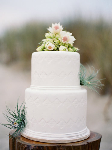 The triangle pattern on this white cake is so subtle, you might not notice it at first — but once you do, you realize what a sweet touch it adds.
Photo by Jose Villa Photography via Style Me Pretty
The triangle pattern on this white cake is so subtle, you might not notice it at first — but once you do, you realize what a sweet touch it adds.
Photo by Jose Villa Photography via Style Me Pretty