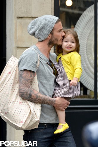 David Beckham planted a kiss on Harper during a family trip to Paris in May.
David Beckham planted a kiss on Harper during a family trip to Paris in May.