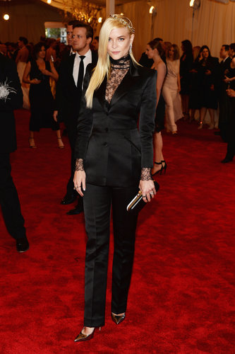 In her first red carpet outing since announcing her pregnancy, Jaime King opted to go the menswear-inspired route in a black Topshop suit with a black lace top. She completed her look with a Finn black diamond ring and a Dauphines of New York crown.
In her first red carpet outing since announcing her pregnancy, Jaime King opted to go the menswear-inspired route in a black Topshop suit with a black lace top. She completed her look with a Finn black diamond ring and a Dauphines of New York crown.