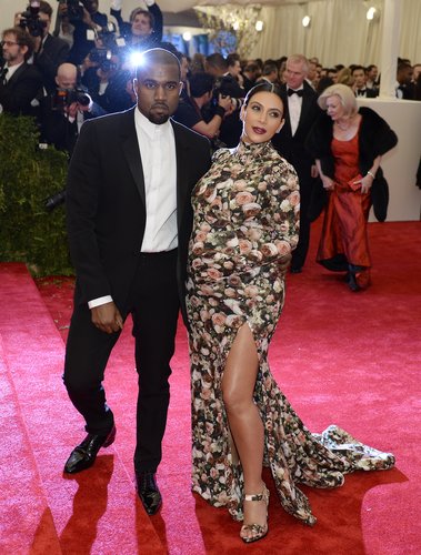 Alongside Kanye West, Kim Kardashian's floral Givenchy by Riccardo Tisci gown featured matching gloves and a high neckline to offset a thigh-high slit.
Alongside Kanye West, Kim Kardashian's floral Givenchy by Riccardo Tisci gown featured matching gloves and a high neckline to offset a thigh-high slit.