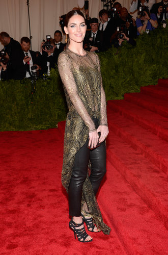 Hilary Rhoda climbed the famous red stairs in a Wes Gordon ensemble, which included a sheer gold lace top with a floor-grazing tail and black leather pants.
Hilary Rhoda climbed the famous red stairs in a Wes Gordon ensemble, which included a sheer gold lace top with a floor-grazing tail and black leather pants.