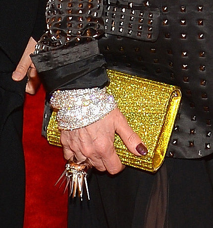 Debbie Harry carried a glitzy clutch and added punk appeal with a spiked ring.
Debbie Harry carried a glitzy clutch and added punk appeal with a spiked ring.