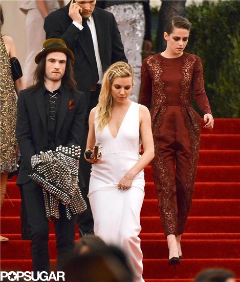 Kristen Stewart, Sienna Miller, and Tom Sturridge at the Met Gala 2013. Kristen Stewart, Sienna Miller, and Tom Sturridge at the Met Gala 2013.