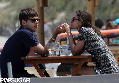 James Righton and Keira Knightley held hands across the table.
James Righton and Keira Knightley held hands across the table.