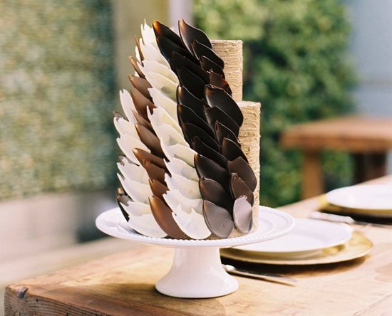 This simple two-tiered cake is given an edgy touch with carefully placed chocolate petals — stunning!
Photo by Lane Dittoe via Green Wedding Shoes
This simple two-tiered cake is given an edgy touch with carefully placed chocolate petals — stunning!
Photo by Lane Dittoe via Green Wedding Shoes