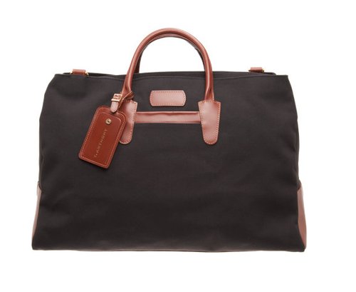 T. Anthony's black weekend duffel ($395) features a unisex design, which means your man can borrow it when he heads out of town.
T. Anthony's black weekend duffel ($395) features a unisex design, which means your man can borrow it when he heads out of town.