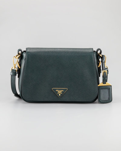 A luxurious bag for day is a key part of any work ensemble. We love that this classic Prada shape ($1,495) differentiaties itself in a deep forest green.
A luxurious bag for day is a key part of any work ensemble. We love that this classic Prada shape ($1,495) differentiaties itself in a deep forest green.