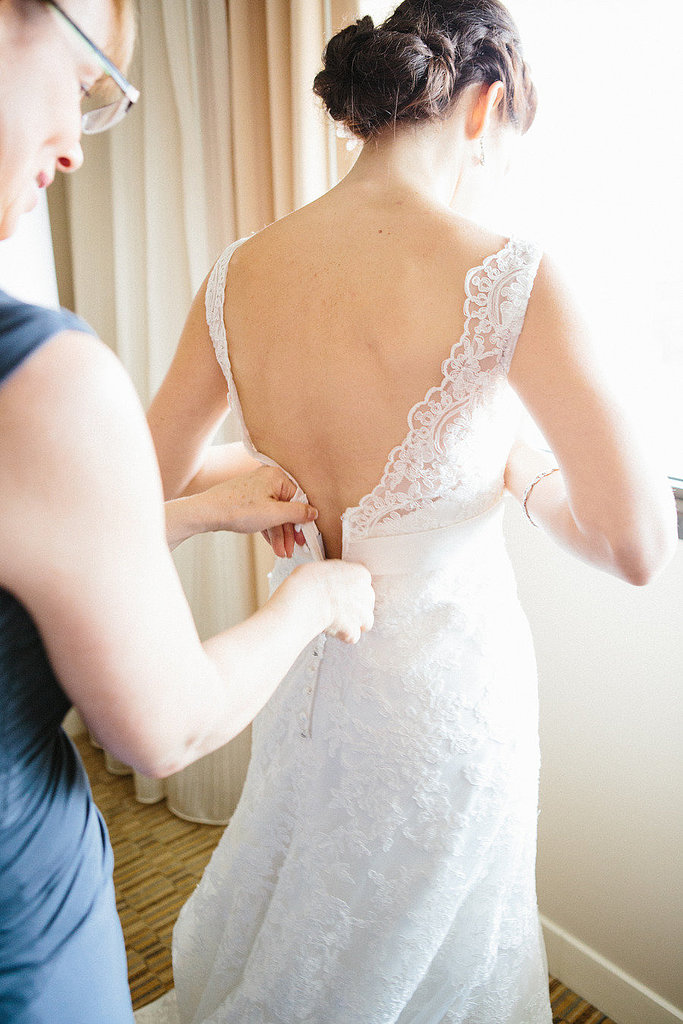 Maid of Honor Zipping Up the Bride Maid of Honor Zipping Up the Bride
