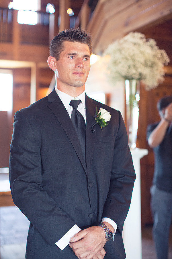 Groom Watching the Bride Walk Down the Aisle Groom Watching the Bride Walk Down the Aisle