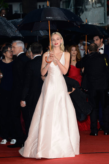 A little rain couldn't stop the Carey fashion train at the 66th Annual Cannes Film Festival. The leading lady blossomed in a matte blush Dior Haute Couture creation and dripping diamond jewels from Tiffany & Co. — pear-shaped drop earrings and a platinum-set cluster bracelet.
A little rain couldn't stop the Carey fashion train at the 66th Annual Cannes Film Festival. The leading lady blossomed in a matte blush Dior Haute Couture creation and dripping diamond jewels from Tiffany & Co. — pear-shaped drop earrings and a platinum-set cluster bracelet.