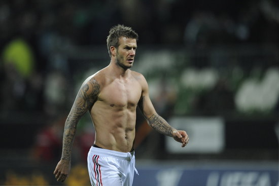 David Beckham walked across the field following a game with AC Milan in February 2009.
David Beckham walked across the field following a game with AC Milan in February 2009.