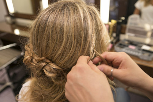 You can create a small French braid that drapes down and connects to the larger braids, or just a regular small braid (as pictured here).
You can create a small French braid that drapes down and connects to the larger braids, or just a regular small braid (as pictured here).