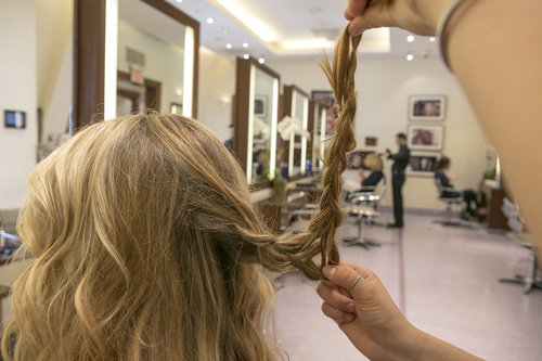 Now you have to drape the braid to create a woven shape in the back of your head. Start off by pulling the dual-braid up and then bend the braid about four inches from your head.
Now you have to drape the braid to create a woven shape in the back of your head. Start off by pulling the dual-braid up and then bend the braid about four inches from your head.