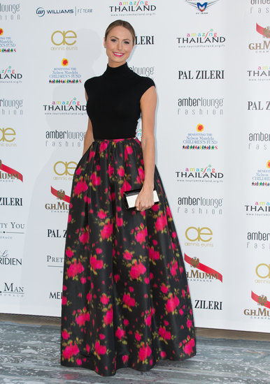 Stacy Keibler made her own red carpet moment, pairing a black knit top and ball skirt, both from Michael Kors's pre-Fall 2013 collection.
Stacy Keibler made her own red carpet moment, pairing a black knit top and ball skirt, both from Michael Kors's pre-Fall 2013 collection.