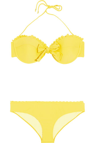 Make your next beach trip more stylish than the last in Miu Miu's cheery, scalloped bikini ($172, originally $245).
Make your next beach trip more stylish than the last in Miu Miu's cheery, scalloped bikini ($172, originally $245).