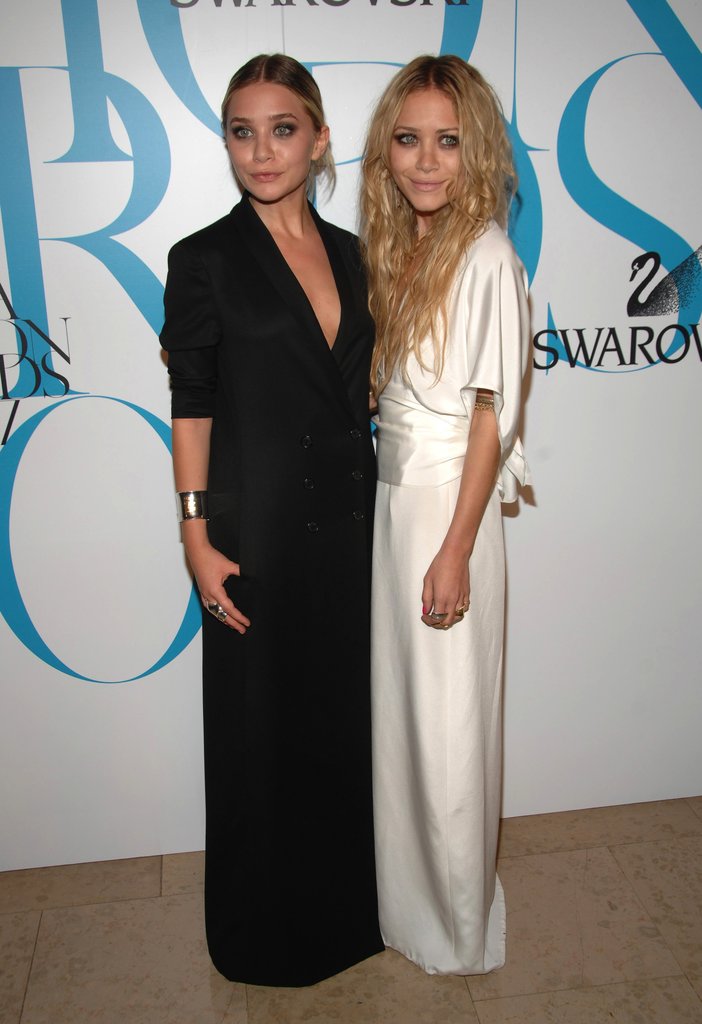 Twinning combo: The girls donned contrasting column gowns for the 25th CFDA Fashion Awards in June 2007.
Ashley borrowed her sister's edgy effervescence in a black tuxedo gown and slick updo.
Mary-Kate took a page from her sister's pristine playbook, working a darling white kimono-style wrap gown.
Twinning combo: The girls donned contrasting column gowns for the 25th CFDA Fashion Awards in June 2007.
Ashley borrowed her sister's edgy effervescence in a black tuxedo gown and slick updo.
Mary-Kate took a page from her sister's pristine playbook, working a darling white kimono-style wrap gown.