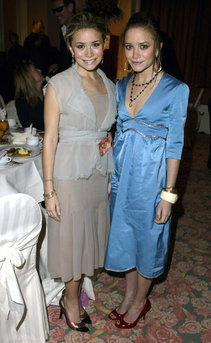 Twinning combo: Midi dresses and stacks of accessories were all the rage for The Hollywood Reporter's Women in Entertainment Power 100 Breakfast in December 2003.
Ashley topped her drop-waist dress with a gauzy wrap, complete with an orange rose brooch.
Mary-Kate donned a light-blue metallic-trim number with dark red pumps.
Twinning combo: Midi dresses and stacks of accessories were all the rage for The Hollywood Reporter's Women in Entertainment Power 100 Breakfast in December 2003.
Ashley topped her drop-waist dress with a gauzy wrap, complete with an orange rose brooch.
Mary-Kate donned a light-blue metallic-trim number with dark red pumps.