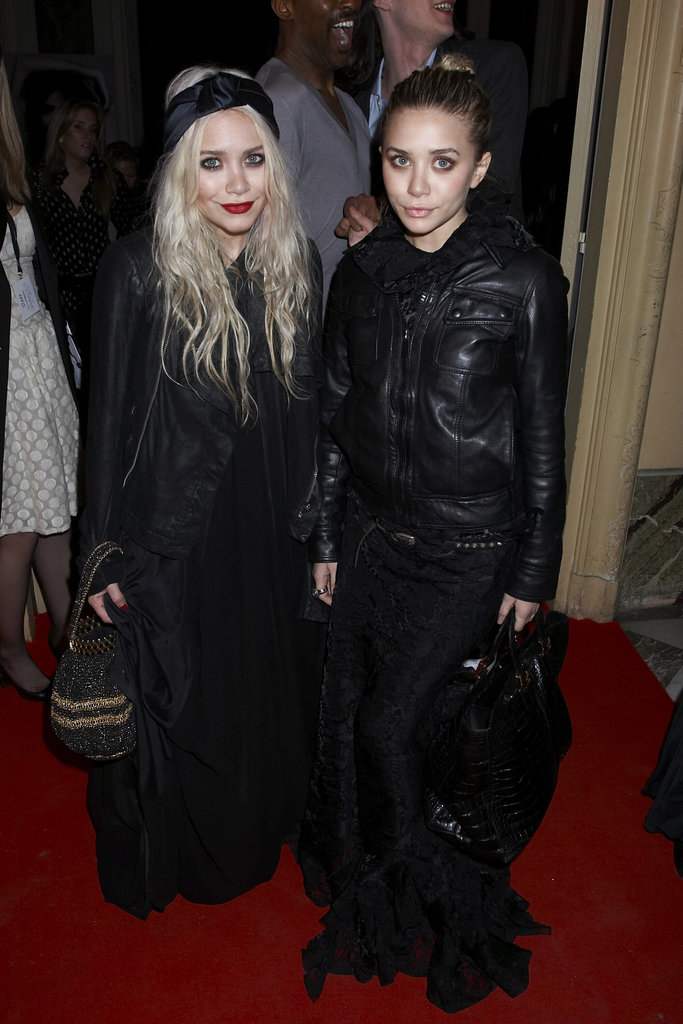 Twinning combo: It was all about leather jackets and black maxis for the Giambattista Valli Fall/Winter 2007 show during Paris Fashion Week.
Mary-Kate finished off her LBG — long black gown — with an open leather jacket, satin turbin, and beaded bag.
Ashley zipped her soft leather topper over a dramatic lace gown and toted a black crocodile bag.
Twinning combo: It was all about leather jackets and black maxis for the Giambattista Valli Fall/Winter 2007 show during Paris Fashion Week.
Mary-Kate finished off her LBG — long black gown — with an open leather jacket, satin turbin, and beaded bag.
Ashley zipped her soft leather topper over a dramatic lace gown and toted a black crocodile bag.