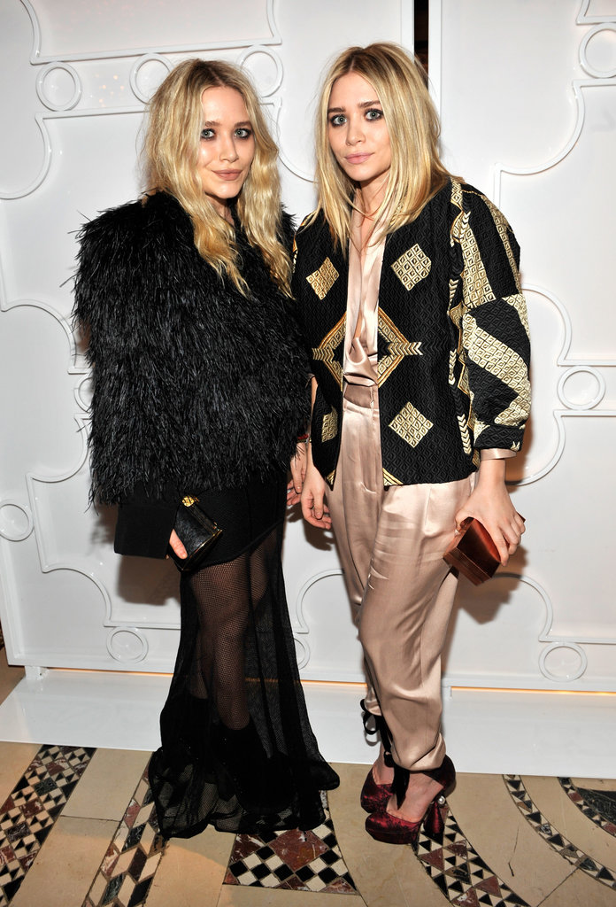 Twinning combo: Once again proving it's all about a statement coat at amfAR's Fall 2010 Fashion Week kickoff party.
Mary-Kate upped the intrigue by layering a full-feathered jacket over her sheer-overlay dress.
Ashley topped her silk champagne separates with a black-and-gold geometric-print jacket.
Twinning combo: Once again proving it's all about a statement coat at amfAR's Fall 2010 Fashion Week kickoff party.
Mary-Kate upped the intrigue by layering a full-feathered jacket over her sheer-overlay dress.
Ashley topped her silk champagne separates with a black-and-gold geometric-print jacket.