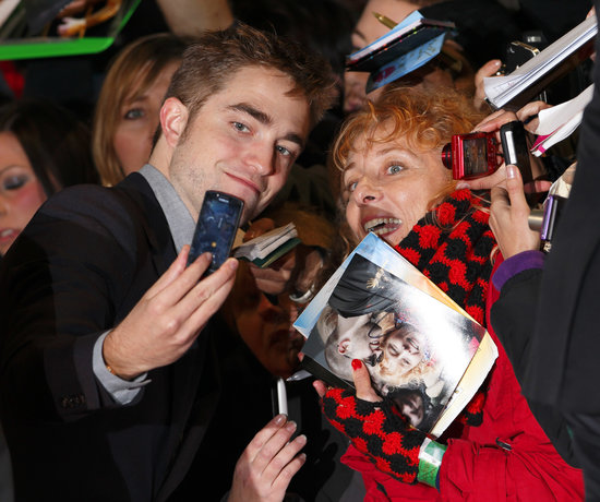 Robert Pattinson smiled with a fan in November 2012 before heading into the London premiere of Breaking Dawn Part 2.
Robert Pattinson smiled with a fan in November 2012 before heading into the London premiere of Breaking Dawn Part 2.