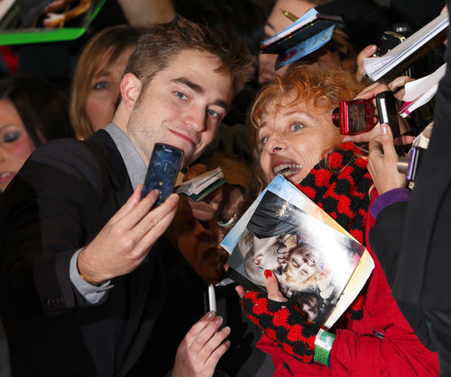 Robert Pattinson smiled with a fan in November 2012 before heading into the London premiere of Breaking Dawn Part 2.
Robert Pattinson smiled with a fan in November 2012 before heading into the London premiere of Breaking Dawn Part 2.