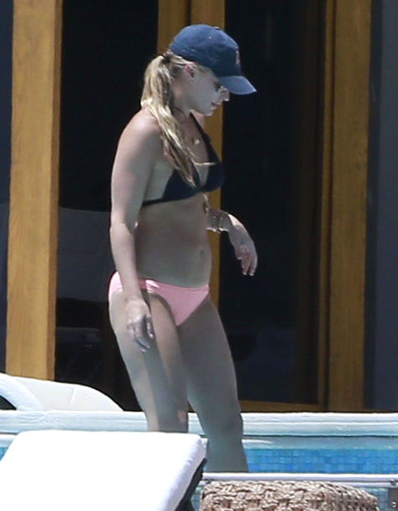 Molly Sims topped her long ponytail with a classic baseball cap for a sporty style while lounging poolside.
Molly Sims topped her long ponytail with a classic baseball cap for a sporty style while lounging poolside.