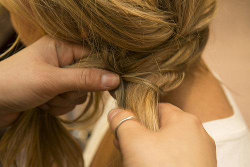 Once you've braided the hair, it should meet with the original twist behind your ear. Gather the hair into one section and start to fishtail-braid the hair (close-up and how-to on next slide). If you're not a pro yet, Guillen recommends securing with an elastic before you start braiding, and then cut the elastic once you've completed your braid.
Once you've braided the hair, it should meet with the original twist behind your ear. Gather the hair into one section and start to fishtail-braid the hair (close-up and how-to on next slide). If you're not a pro yet, Guillen recommends securing with an elastic before you start braiding, and then cut the elastic once you've completed your braid.