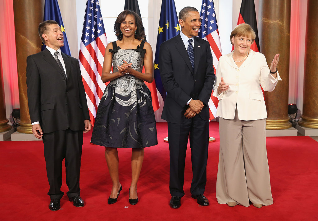 For her latest European appearance, a dinner at the Charlottenburg Palace in Berlin, Michelle Obama looked undeniably fabulous in a printed fit-and-flare dress — we especially adore the bow detail.
For her latest European appearance, a dinner at the Charlottenburg Palace in Berlin, Michelle Obama looked undeniably fabulous in a printed fit-and-flare dress — we especially adore the bow detail.