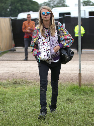Cara Delevingne anchored her bright bomber and mirrored sunglasses with black skinnies and a dark shoulder bag.
Cara Delevingne anchored her bright bomber and mirrored sunglasses with black skinnies and a dark shoulder bag.