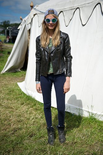 Cara Delevingne sported a backwards baseball cap with funky round sunglasses, and a camouflage tee at Glastonbury.
Cara Delevingne sported a backwards baseball cap with funky round sunglasses, and a camouflage tee at Glastonbury.
