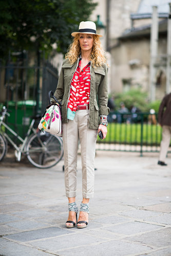 Mix and match all the pieces you love, like this showgoer's artful combination of cherry red blouse, army parka, statement sandals, and hat.
Mix and match all the pieces you love, like this showgoer's artful combination of cherry red blouse, army parka, statement sandals, and hat.