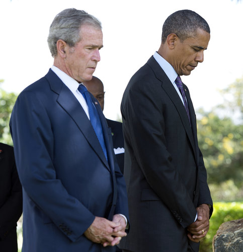 At the July wreath-laying ceremony for victims of the 1998 US Embassy bombing in Tanzania, President Obama and former President Bush bowed their heads in respect.
At the July wreath-laying ceremony for victims of the 1998 US Embassy bombing in Tanzania, President Obama and former President Bush bowed their heads in respect.
