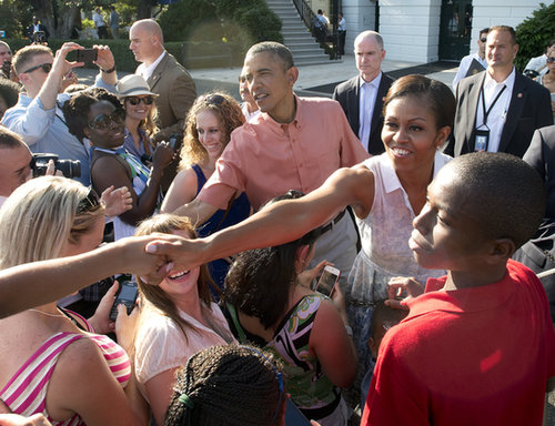 President Obama and First Lady Michelle greeted the crowd during the White House Fourth of July BBQ honoring military families in 2013.
President Obama and First Lady Michelle greeted the crowd during the White House Fourth of July BBQ honoring military families in 2013.