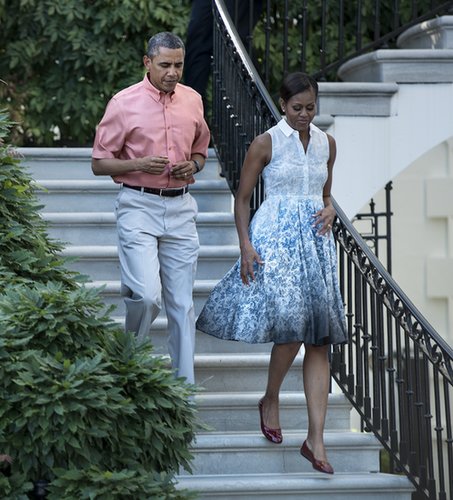 President Obama and Michelle Obama walked down to the White House's South Lawn with the first lady looking retro in a blue printed shirtdress and red patent ballet flats.
President Obama and Michelle Obama walked down to the White House's South Lawn with the first lady looking retro in a blue printed shirtdress and red patent ballet flats.
