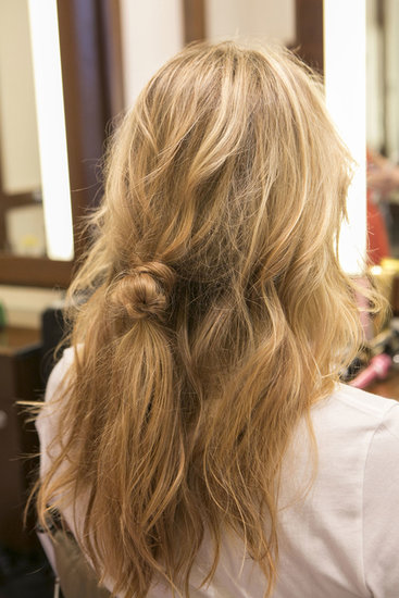 Now your hair should look like this, with a loose knot in the middle of your hair. It might look awkward, but you'll need it for later in the look.
Now your hair should look like this, with a loose knot in the middle of your hair. It might look awkward, but you'll need it for later in the look.