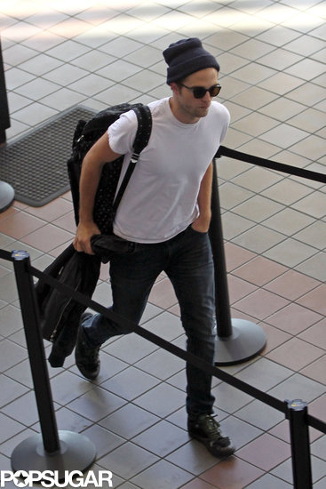 Exclusive: Robert Pattinson Smolders His Way Through Airport Security