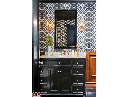 A charcoal trellis pattern on the walls helps to modernizes the wooden wainscoting.
A charcoal trellis pattern on the walls helps to modernizes the wooden wainscoting.