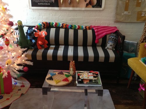 A mod couch is the perfect backdrop for a bright array of toys and games.
A mod couch is the perfect backdrop for a bright array of toys and games.