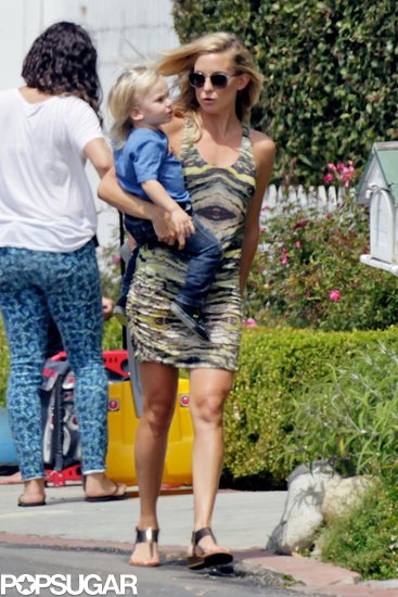 Kate Hudson held on to her son Bingham as she visited Ryder's lemonade stand.
Kate Hudson held on to her son Bingham as she visited Ryder's lemonade stand.