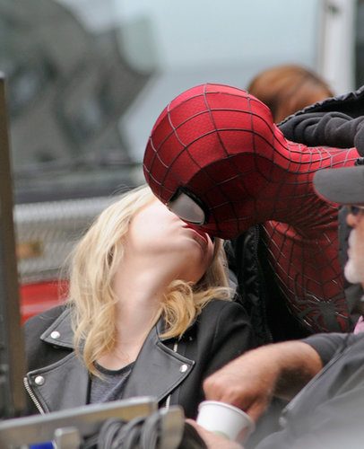 Andrew Garfield, who was sporting his Spider-Man costume, gave Emma Stone a kiss during a break from filming in NYC in May 2013.
Andrew Garfield, who was sporting his Spider-Man costume, gave Emma Stone a kiss during a break from filming in NYC in May 2013.