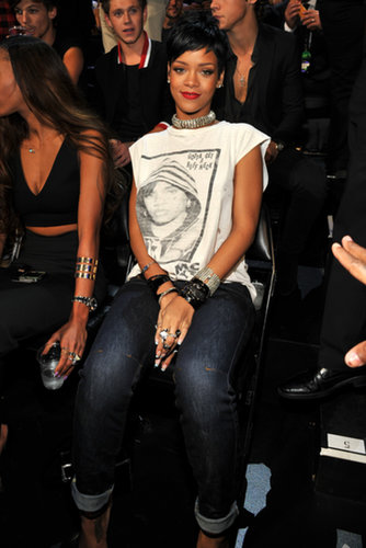 Rihanna went casual in a white muscle tee and cuffed denim, which she amped up with tons of shiny baubles.
Rihanna went casual in a white muscle tee and cuffed denim, which she amped up with tons of shiny baubles.