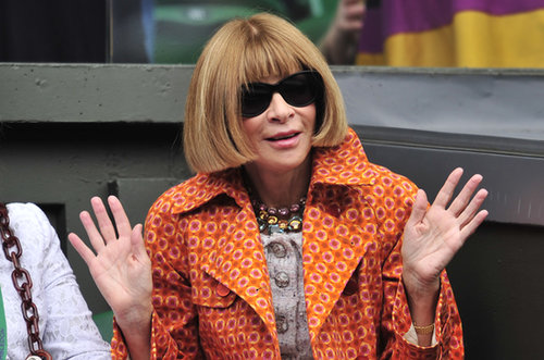 See? A bright orange trench calls for a double wave. (Or dare we guess, is she raising the roof?)
See? A bright orange trench calls for a double wave. (Or dare we guess, is she raising the roof?)