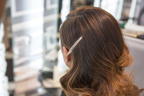 You can mix a shine serum with a little hair spray in your hands to really smooth out the hair around the part.
You can mix a shine serum with a little hair spray in your hands to really smooth out the hair around the part.